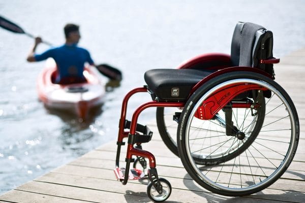 Argon2 wheelchair in red at scene of canoe Derbyshire Mobility