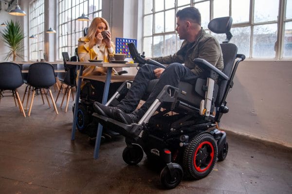couple meeting for dinner in q300m mini powerchair