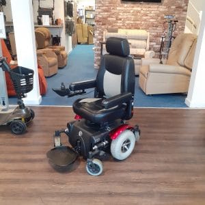 Red preloved Rascal power chair front side